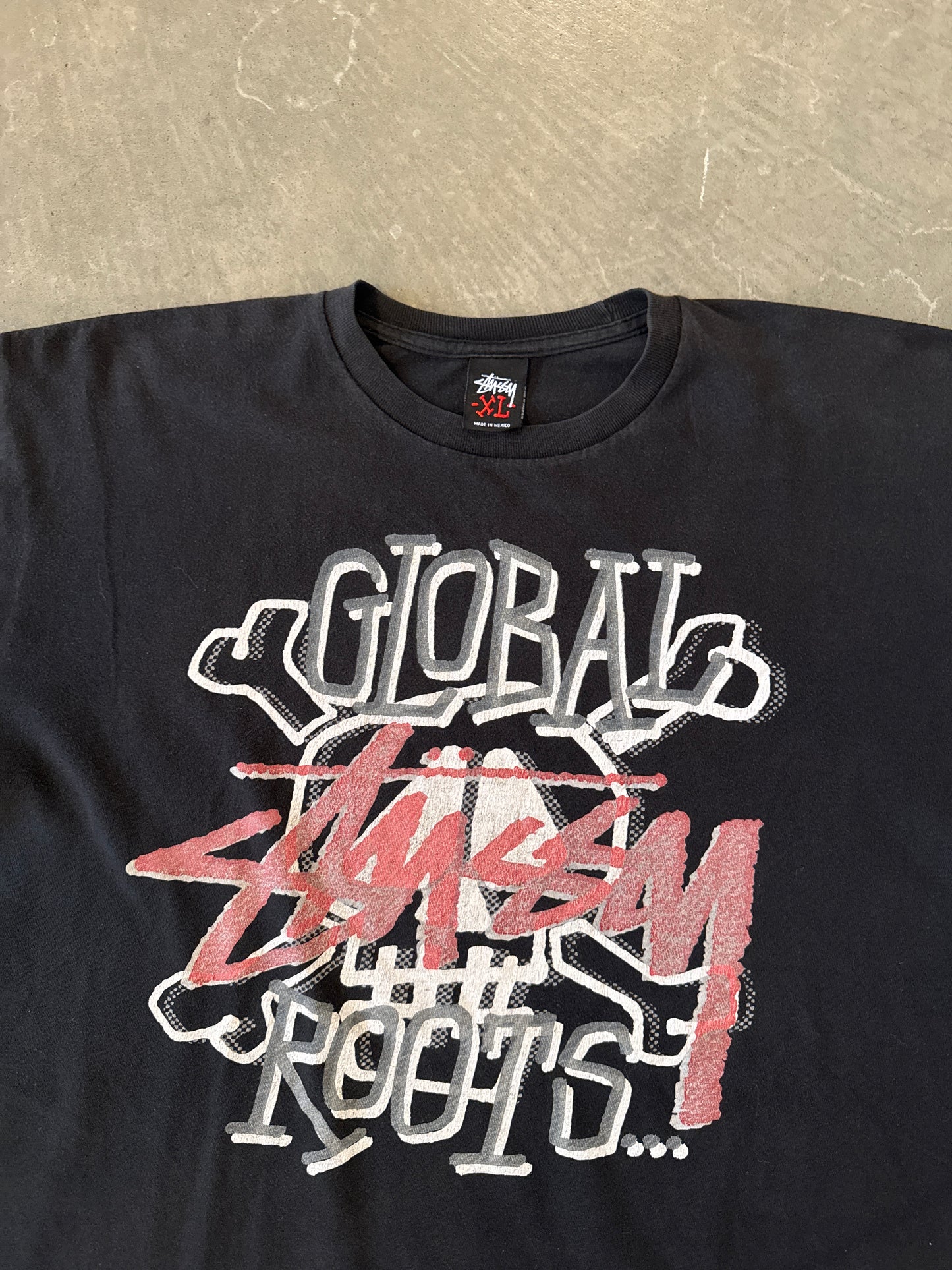 Vintage Stussy Global Roots Skull Tee